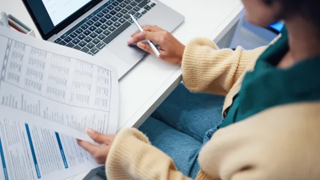 person doing their taxes online 