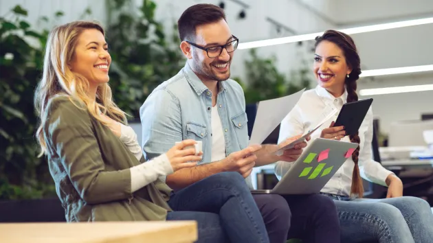 group of employees smiling 