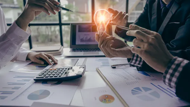 finance and innovation concept - idea - lightbulb