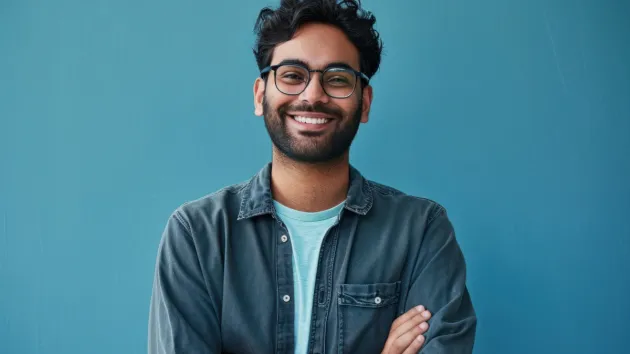 Smiling male  wearing glasses