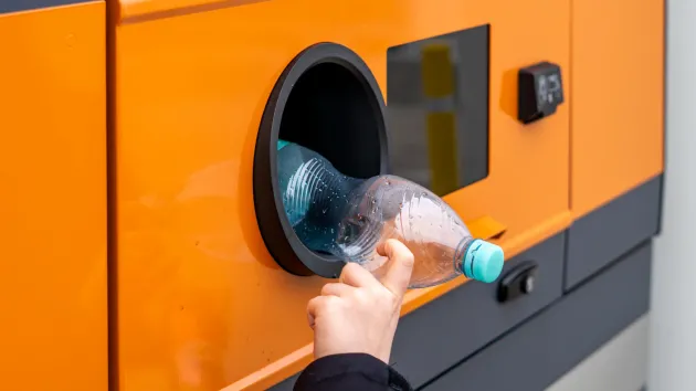 plastic bottle in a deposit return scheme machine 