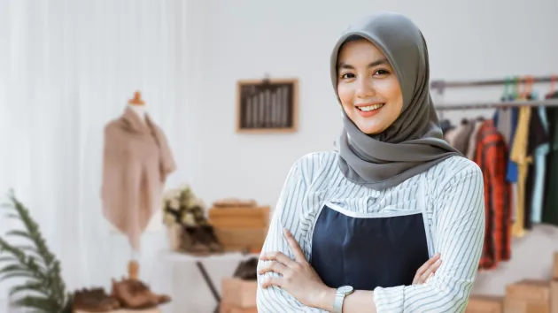 Muslim Business owner wearing a headscarf in her shop 