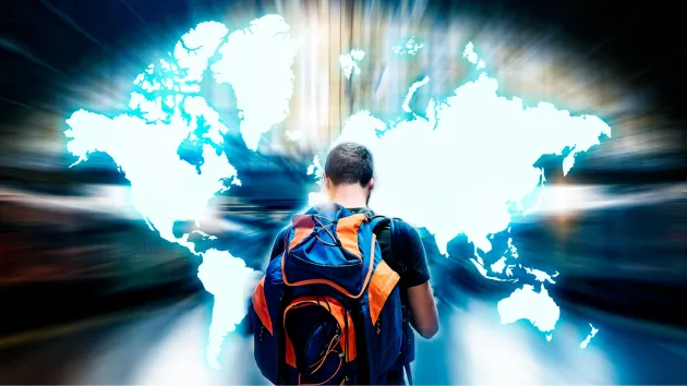 Tourist looking at a digital map of the world