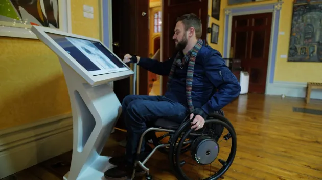Wheelchair user at a museum