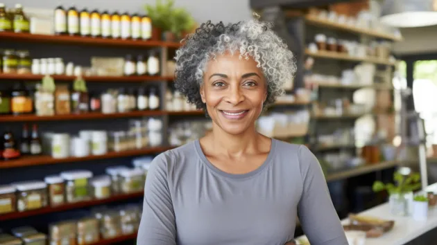 mature woman working in a health care shop 