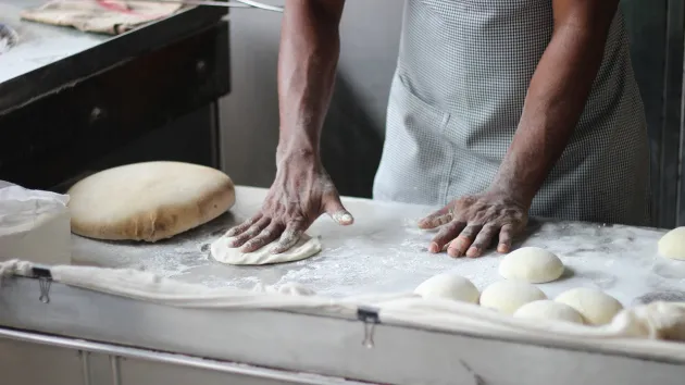 baker making bread