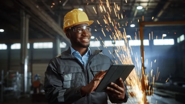Engineer looking at a digital tablet