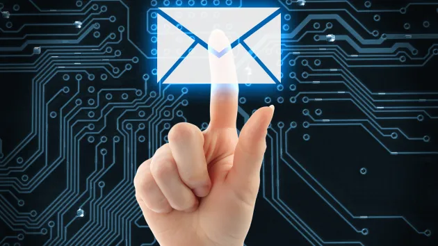 Hand pushing virtual mail button on digital background