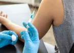 person administering an injection