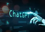 Text - ChatGPT with a robot pointing at the text 
