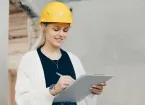 female engineer checking work on a building site 