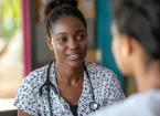 Health care worker checking the health of a worker 