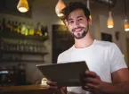 person looking at an electronic tablet