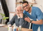 male social care worker with mature client 