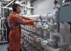 Marine Engineer in boiler room of a ship 