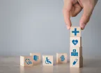 wooden blocks with medical logos - wheelchair, heart, stethoscope 