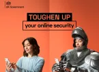Cyber security - woman wearing a suit of armour looking at a digital device 
