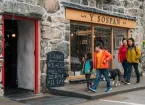 Visitors in Dolgellau outside a shop 