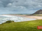 Rhossili Bay and Busnes Cymru / Business Wales logo