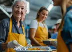 Older person volunteering in a community kitchen