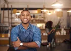 Restaurant - owner wearing a blue apron