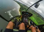 People in helicopter flying over the sea 