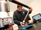 Unimaq staff using a measuring tool - manufacturing 