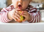 child eating an apple