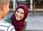 woman wearing a headscarf in conversation 