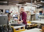 Man working in printing press office 