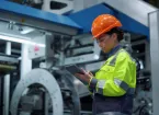 female engineer holding a digital device 