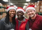 warehouse workers wearing santa hats