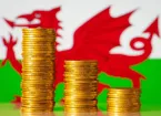 Welsh flag and stacks of coins 