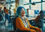 Wheelchair user working in an office    