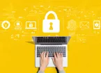 Yellow background, laptop and cyber security digital symbols, padlock, fingerprint 