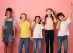 group of children wearing headphones listening to music