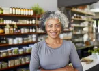 mature woman working in a health care shop 