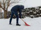 person clearing snow