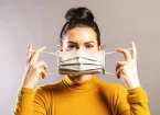 Woman wearing an anti virus protection mask to prevent others from COVID-19 