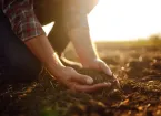 farmer holding soil in their hands