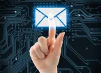 Hand pushing virtual mail button on digital background