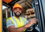Warehouse worker driving a vehicle 
