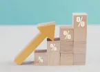 wooden blocks with percentage signs rising 