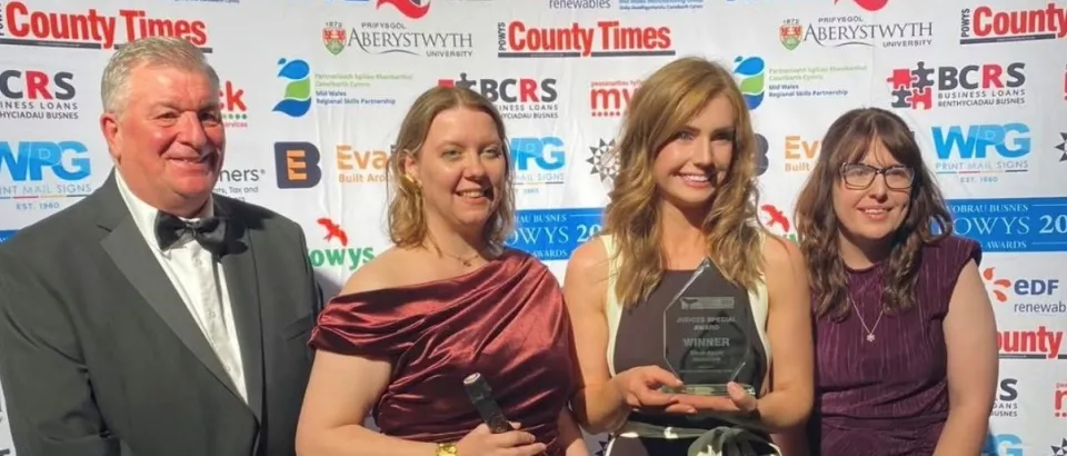 Silver Assist team at an awards ceremony