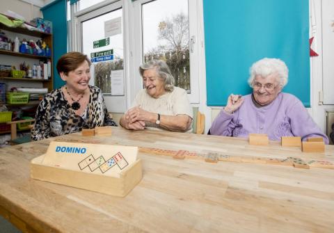 Elderly women playing Dominoes