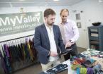 Two men looking at electronic point of sale system