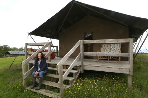 Wonderfully Wild owner, Victoria Roberts, at a luxury glamping building.