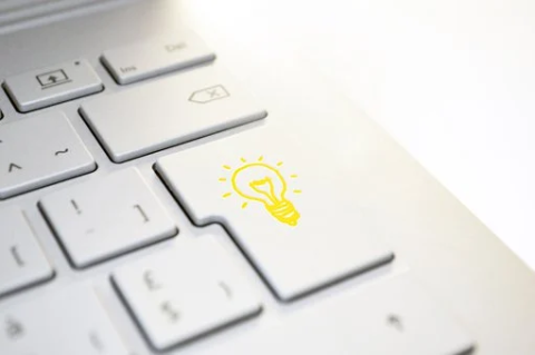 Picture of a keyboard with a lightbulb image depicted on one of the keys