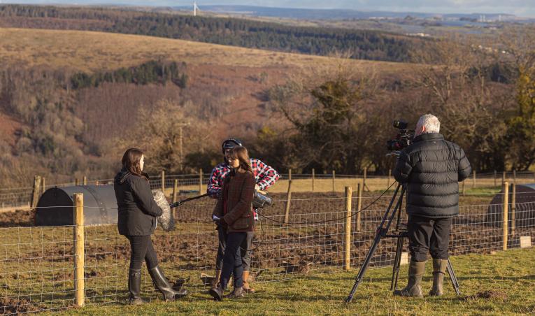 A film crew from S4C at Puff Pigs farm near Mountain Ash discussing Porc from Wales Week_