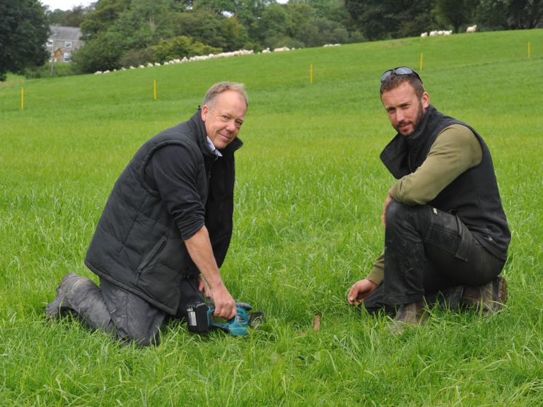 Chris Duller and Geraint Davies measuring grass yield 